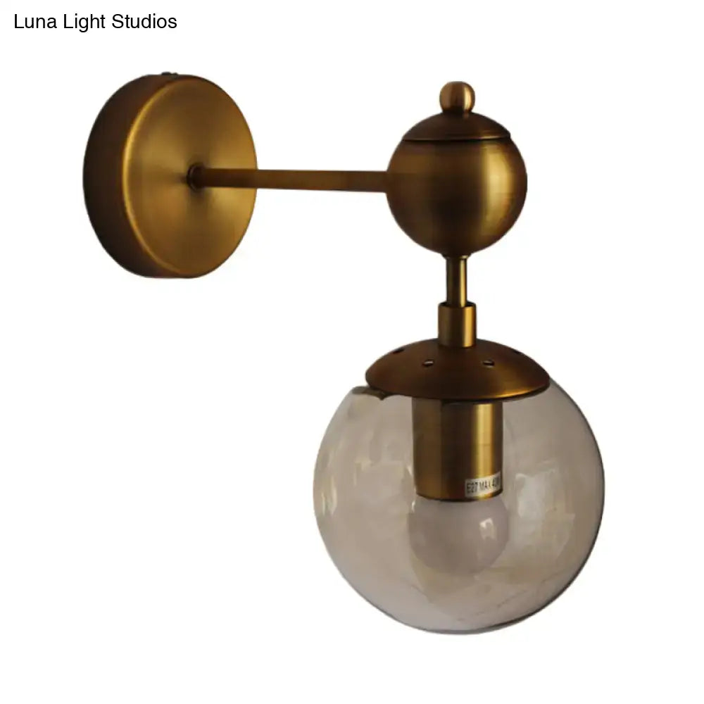 Post modern wall light with antique brass finish and amber textured glass globe for e26 e27 bulbs in bedroom sconce style