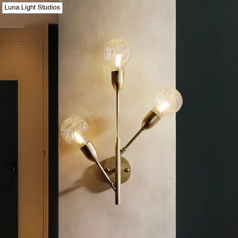 Brass-finished wall light fixture with three clear lattice glass crackled bulbs for post-modern bedroom decor