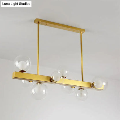 DecorBites gold finish chandelier with orb glass shades and post modern design featuring 8 light bulbs for dining room