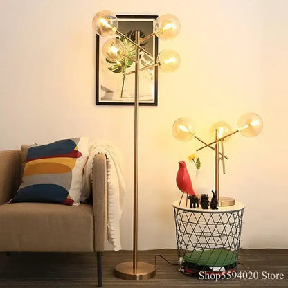 Brass-finished floor lamp with multiple glass bubble balls in a branching design for living room decorbites glass bubble