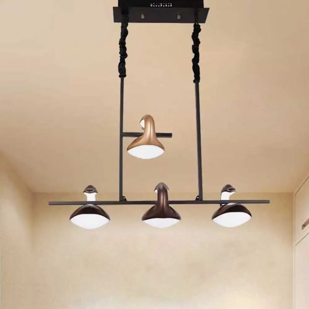 Decorbites multicolored hanging pendant light with three bronze and gold lamp heads and white diffusers in linear chandelier design