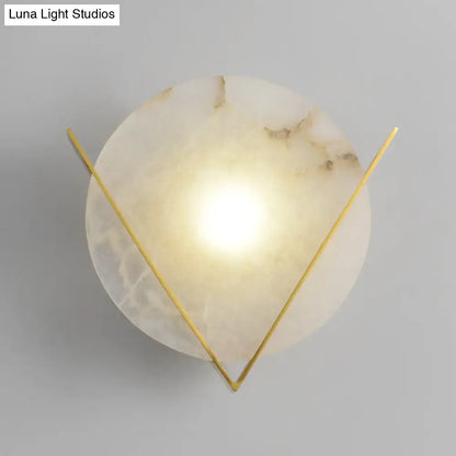 Post modern white marble and gold wall light sconce with round panel wall featuring translucent onyx disc and gold arms