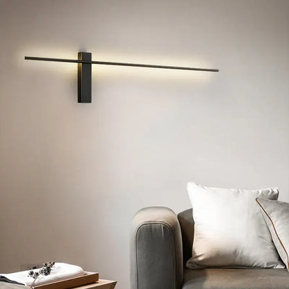 Modern black copper wall lamp with sleek horizontal bar and rectangular base for minimalist bedroom lighting decorbites copper wall