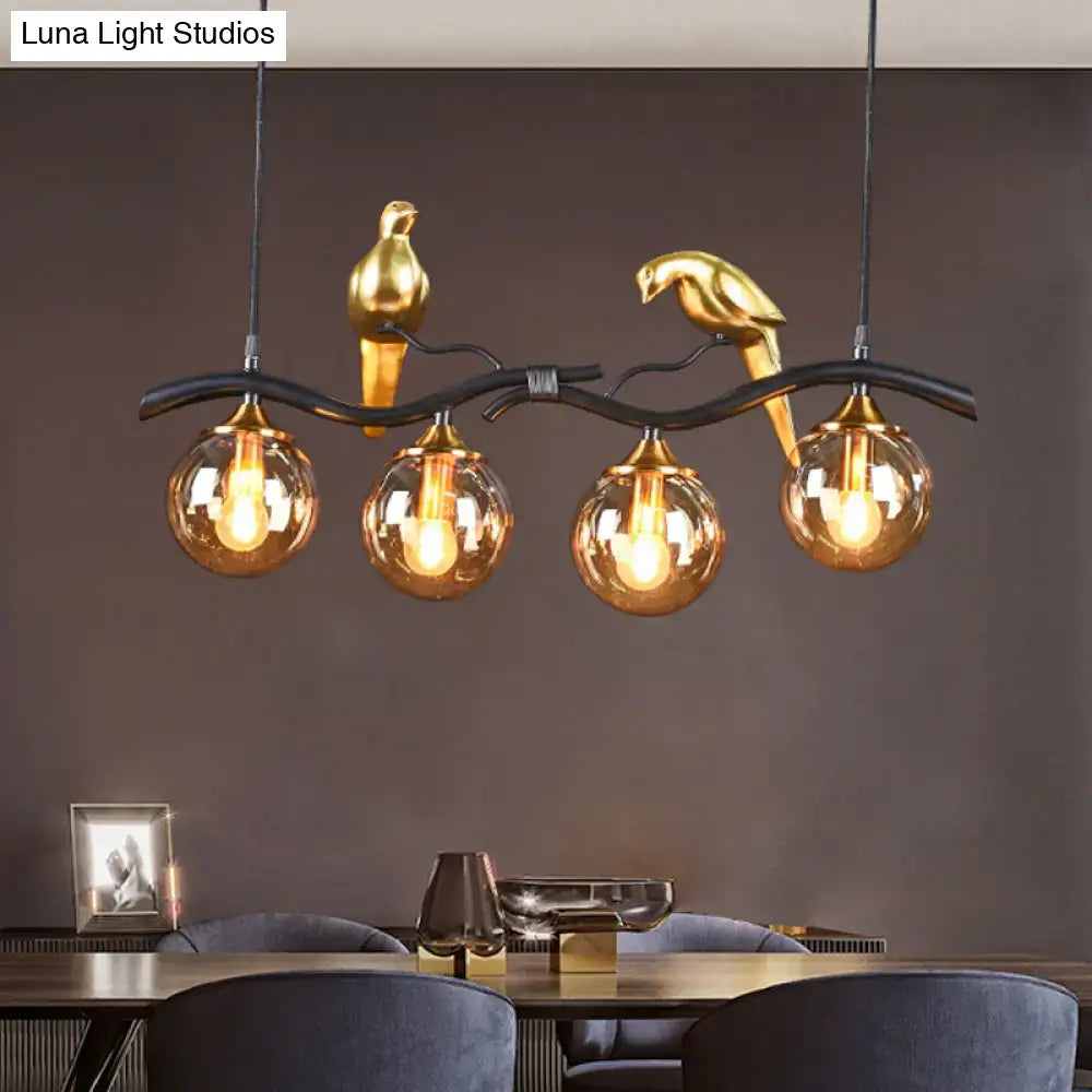Decorbites postmodern iron pendant light with black gold finish, amber ball glass shades, and bird-themed design