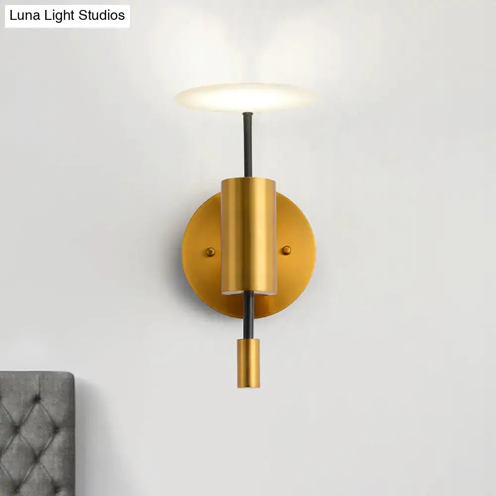 Postmodern black and gold brass tube wall light with gold-toned cylindrical fixture and black central stem for bedroom