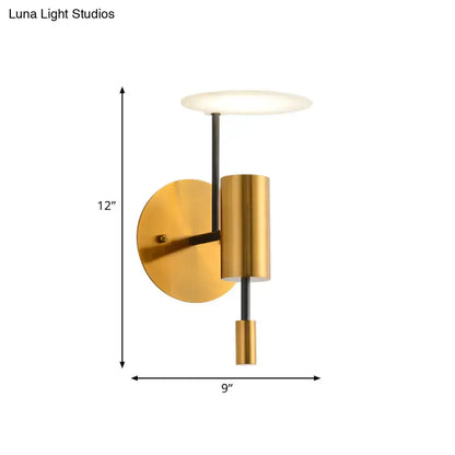 Postmodern black and gold brass tube wall light with a cylindrical body and frosted glass shade fixture height for bedroom use