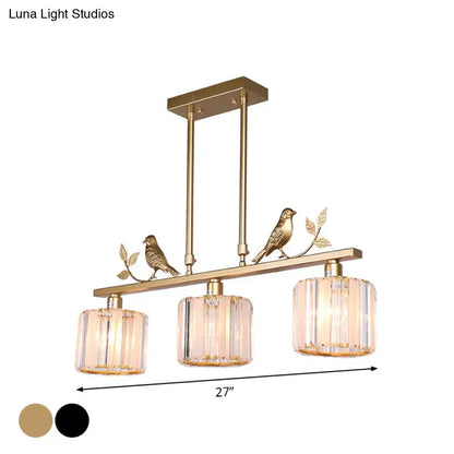 Gold-toned postmodern black gold crystal prism pendant hanging island light with three cylindrical shades and bird decoration