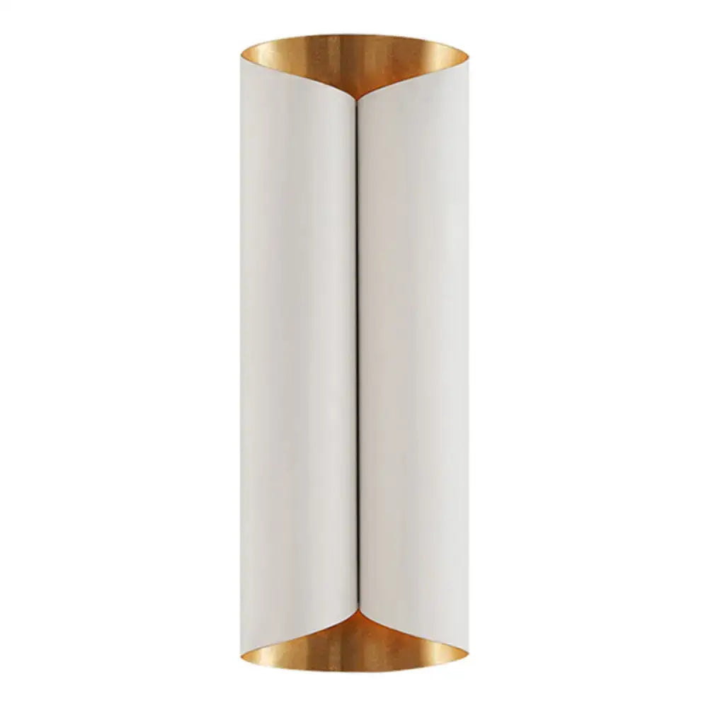 A sleek postmodern wall lamp with a matte white cylindrical metal body and polished gold interior accents