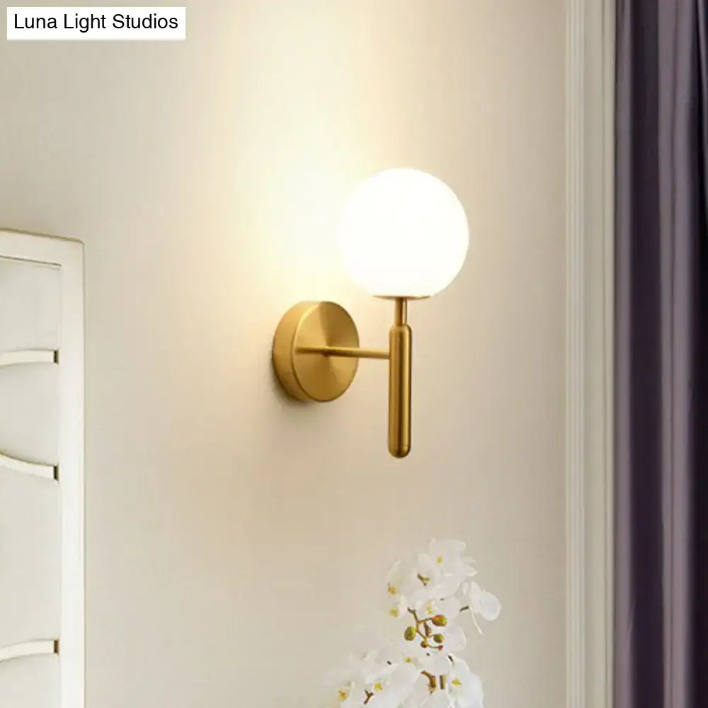 Gold-toned postmodern black gold wall sconce with frosted glass globe for bedroom 110v-120v lighting