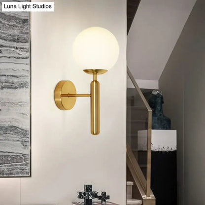 Gold-finished postmodern wall sconce with frosted glass globe 110v-120v black gold bedroom light