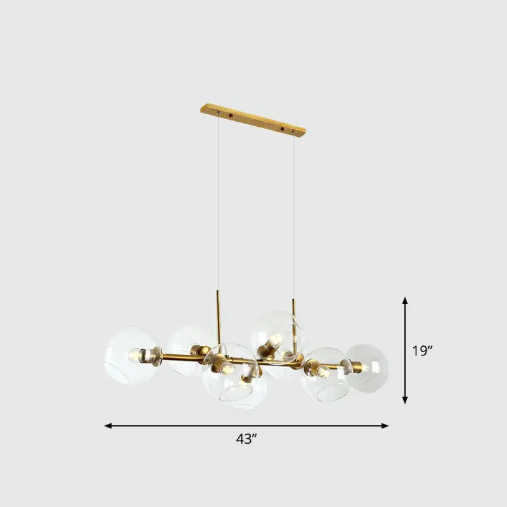Modern brass and glass chandelier with wooden ceiling mount featuring clear smoke grey glass for dining room lighting type