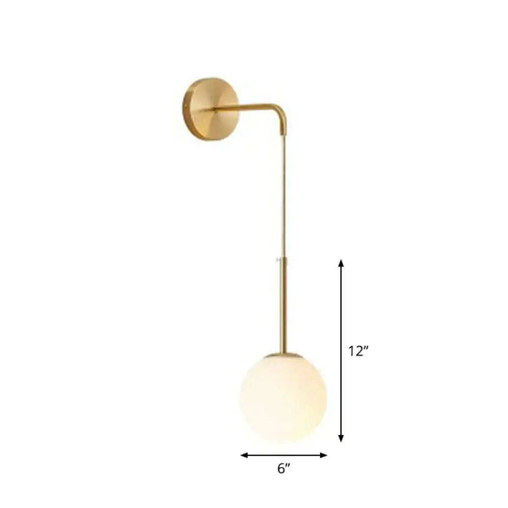 Gold-toned wall lamp with sleek curved arm and frosted glass globe shade ideal for bedroom postmodern decor