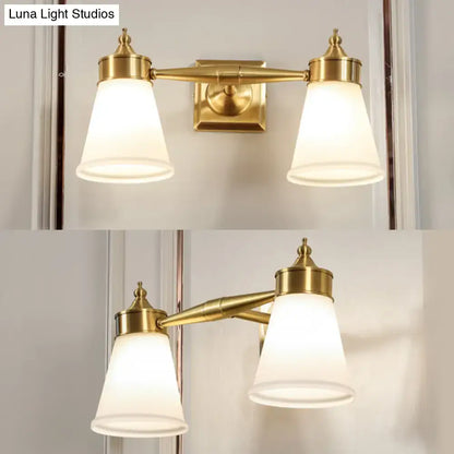 Postmodern brass and cream glass wall sconce with double frosted glass shades for bathroom vanity lighting