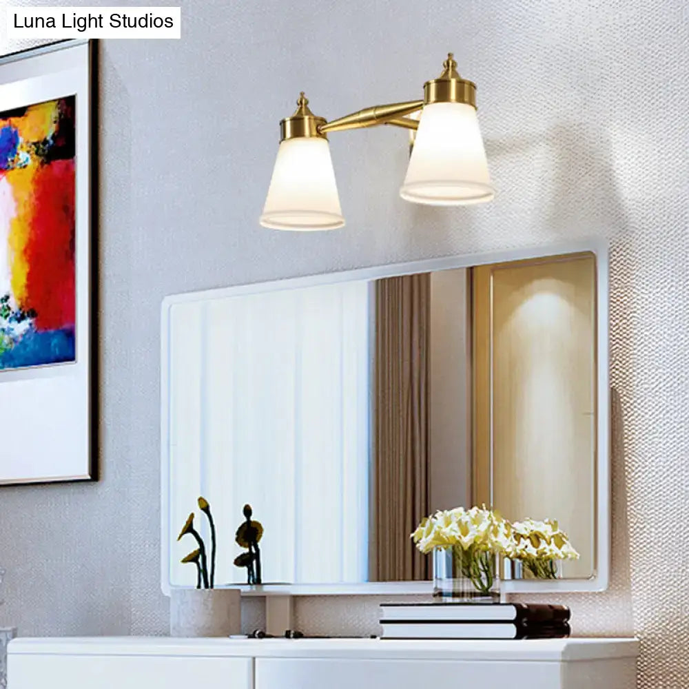Postmodern brass wall sconce with two cream frosted glass shades wall-mounted for bathroom vanity lighting