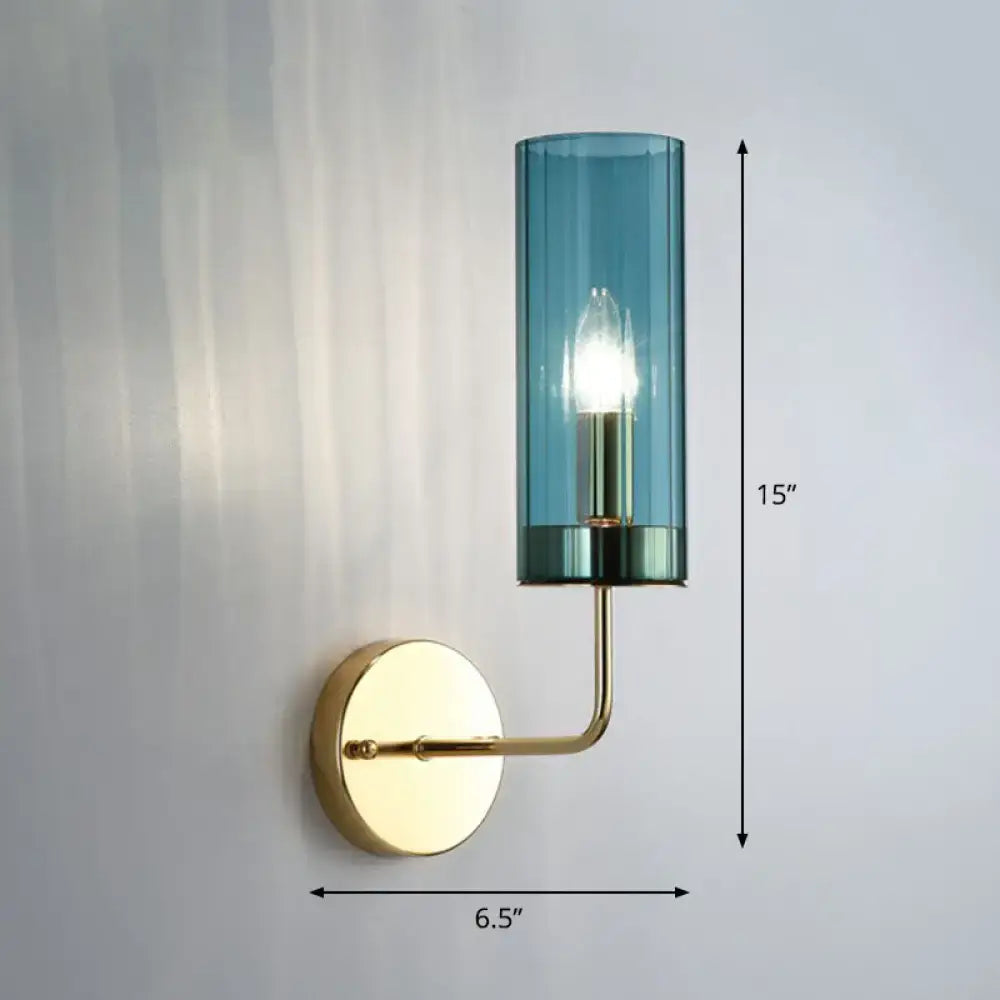 A sleek 15-inch tall wall lamp with brass finish and teal smoked glass shade for bedroom use compatible with e12 e14 bulbs