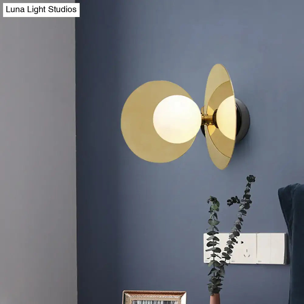 Gold-toned postmodern brass mini milk glass wall light with two disc shades and frosted bulb for 220v-240v use
