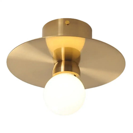Brass-finished postmodern mini milk glass wall light with circular shade and spherical bulb suitable for 220v-240v use