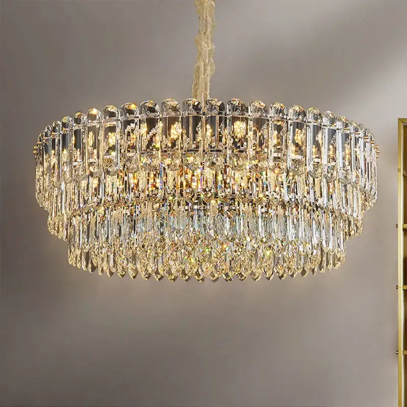 A postmodern decorbites crystal chandelier with cascading clear and gold glass prisms for dining room decor