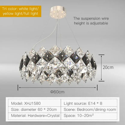 A modern decorbites crystal chandelier with clear and smoky faceted crystals in a geometric oval design