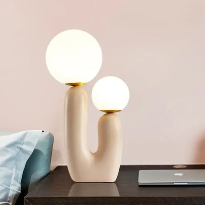 Postmodern cream decorbites glass table lamp with gold accents and two glowing spherical shades for bedroom decor