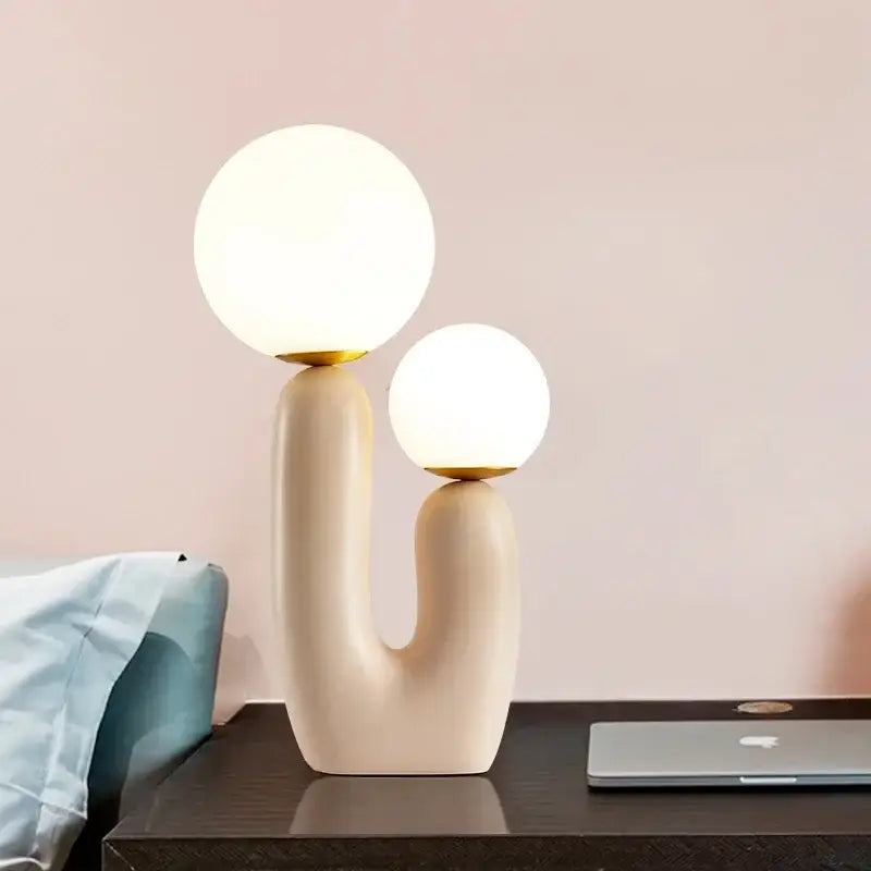 Postmodern cream decorbites glass table lamp with gold accents and two glowing spherical shades for bedroom decor