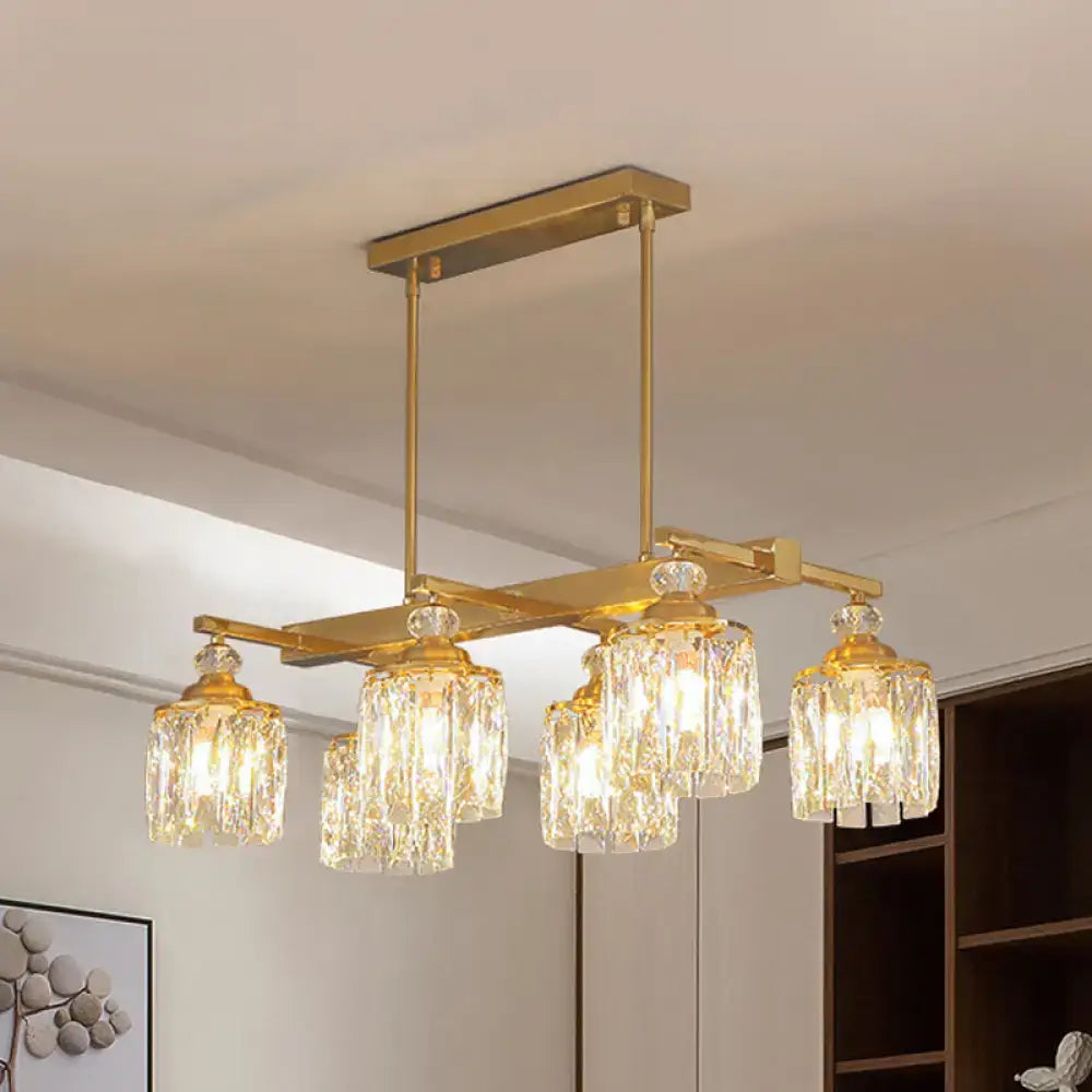 Gold-toned rectangular light fixture with five crystal glass shades for modern crystal gold island lighting