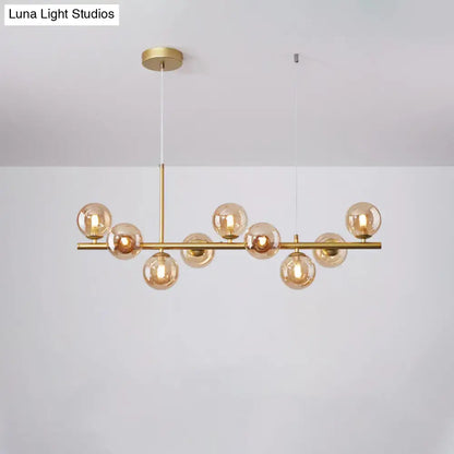 Gold-toned DecorBites postmodern pendant light with amber glass globe bulbs for kitchen in multiple finishes and sizes