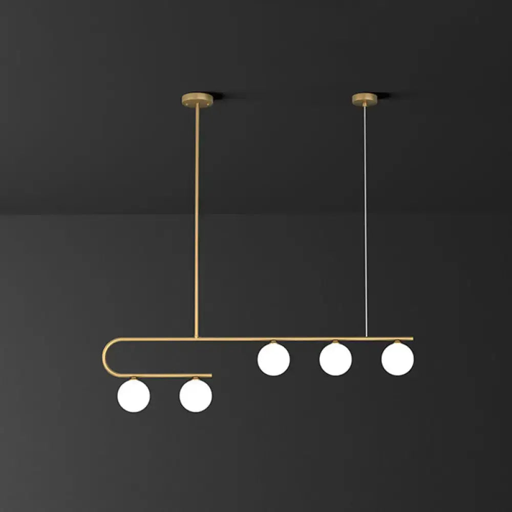 DecorBites™ postmodern gold linear island pendant light with five ivory ball glass bulbs in asymmetrical design