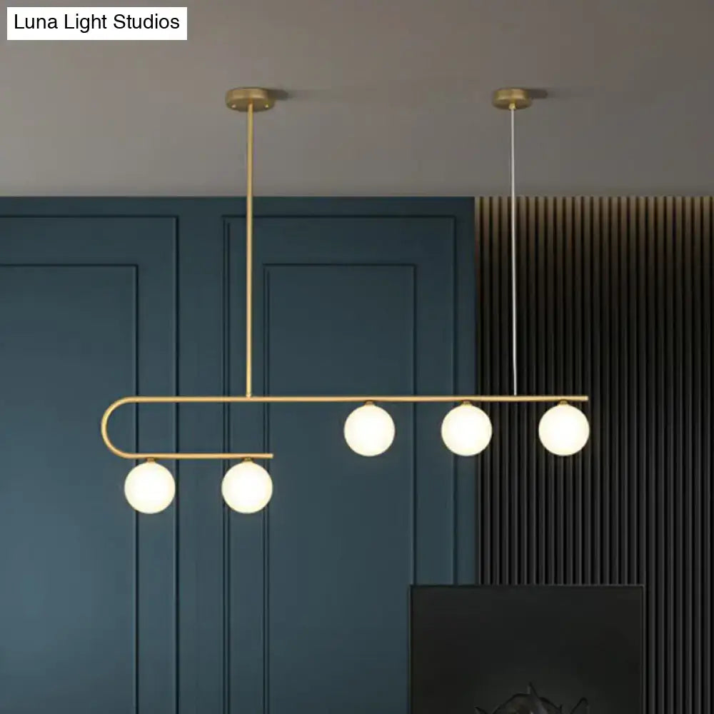 DecorBites™ postmodern gold linear island pendant light with five ivory ball glass bulbs in brass fixture design