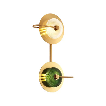 Postmodern wall mounted lamp featuring a gold-toned wall sconce with clear and textured olive glass disc shades