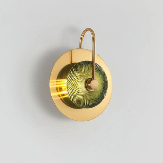 Postmodern gold and olive glass disc wall sconce with a circular brass frame and textured olive-green mesh diffuser wall mounted lamp