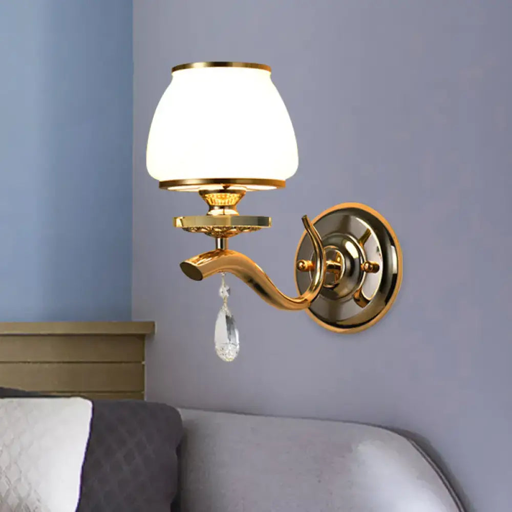 Postmodern gold wall sconce with white glass shade and crystal drop direct wired for bedroom lighting