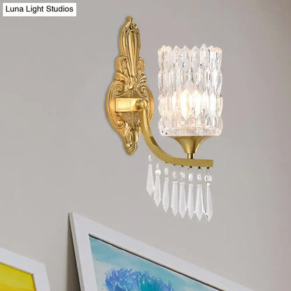 Postmodern gold column wall lamp with ornate finish faceted crystal shade and dangling teardrop crystals for bedroom lighting