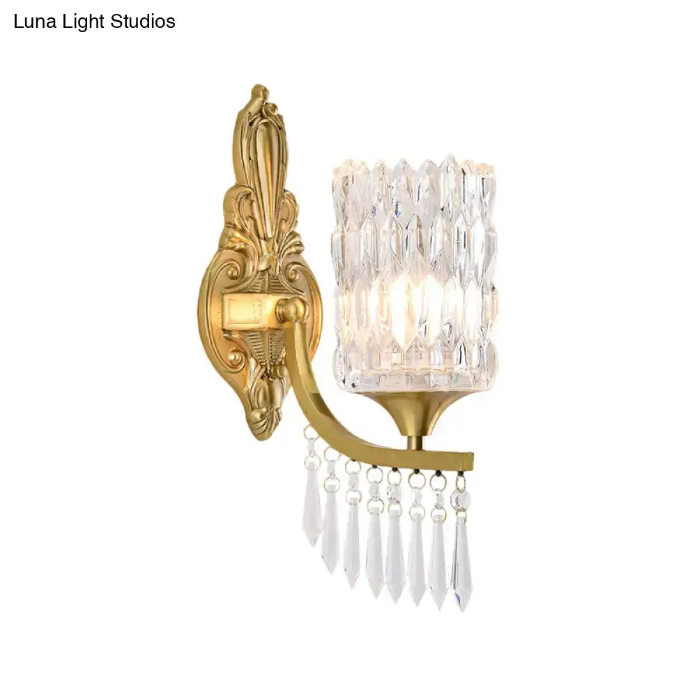 Postmodern gold column wall lamp with ornate gold finish and faceted crystal shade for bedroom lighting fixture