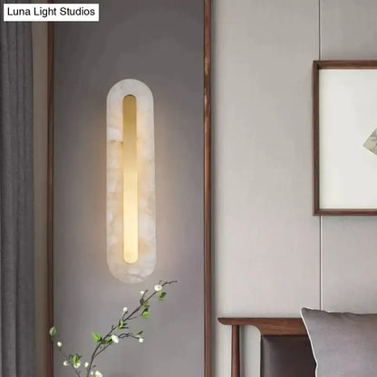 A postmodern wall lamp with copper marble casing and warm golden light for elegant living room decor
