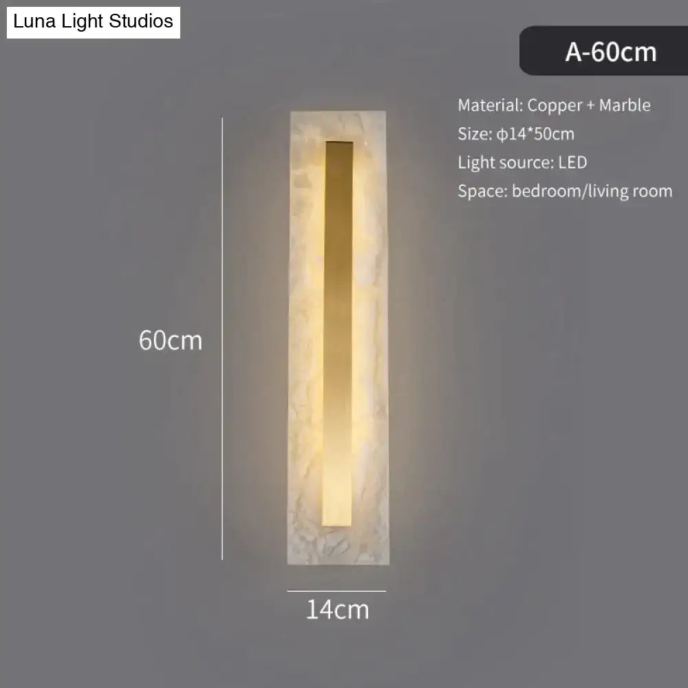 A sleek postmodern copper marble wall lamp with warm lighting for living room featuring rectangular design