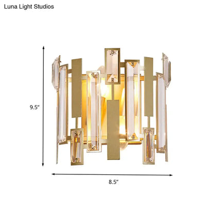 Postmodern gold wall light fixture with clear crystal block accents in a vertical geometric pattern for living room