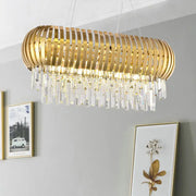 Postmodern gold crystal oval chandelier with vertical slats and dangling prisms for dining room island lighting