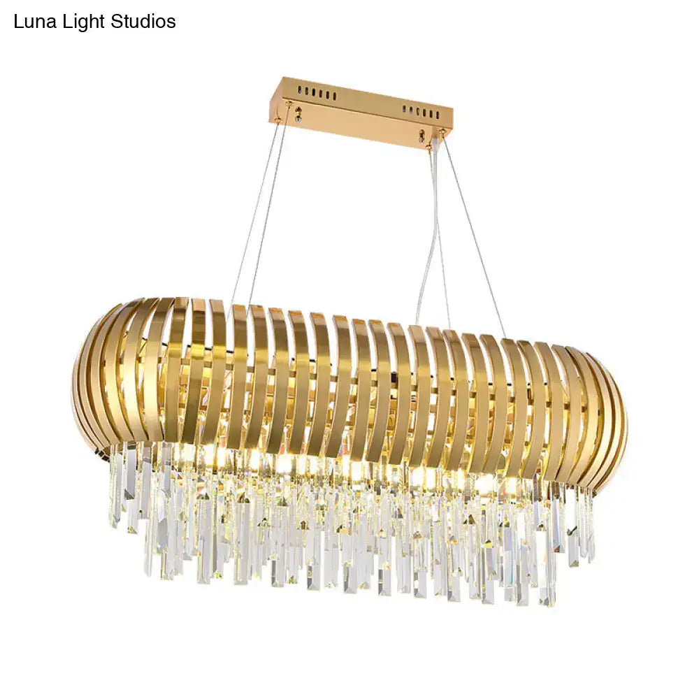 Postmodern gold crystal oval chandelier with sleek metallic slats and clear prisms for dining room island lighting