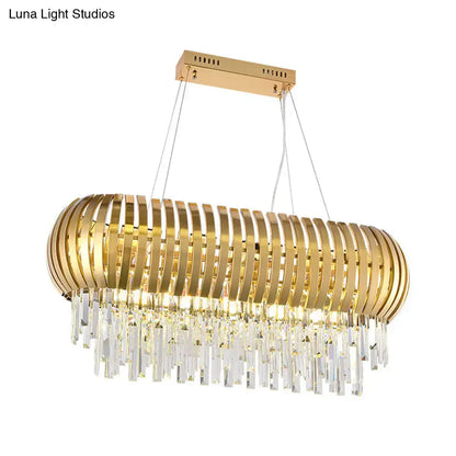 Postmodern gold crystal oval chandelier with sleek metallic slats and clear prisms for dining room island lighting