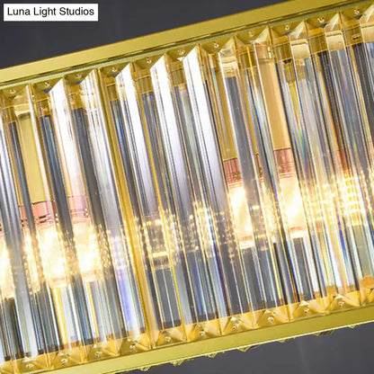 DecorBites gold crystal rod island light with rectangular shade shape and clear faceted prisms refracting warm light
