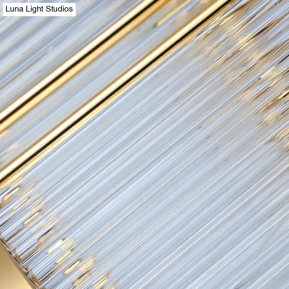 A modern postmodern gold crystal rod island light with slender translucent glass rods for dining room use