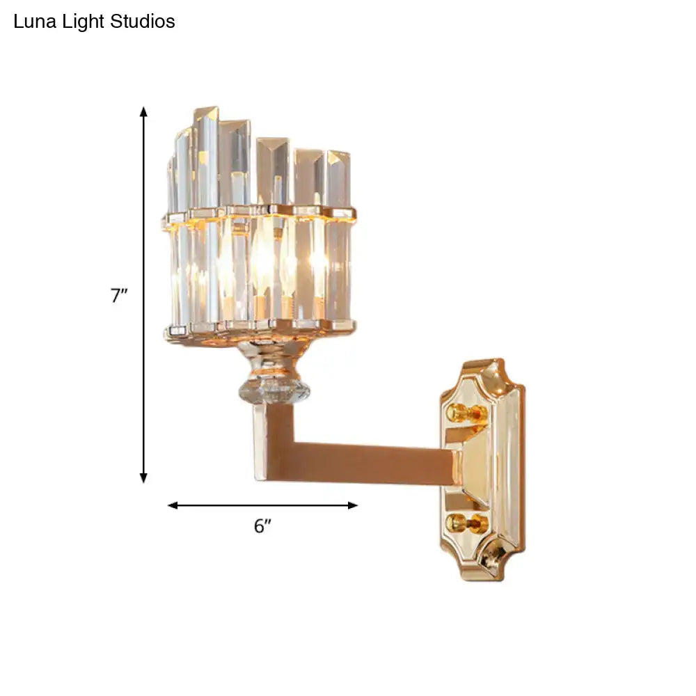 Postmodern gold crystal rod wall light featuring a gold-finished single wall light with clear faceted crystal columns