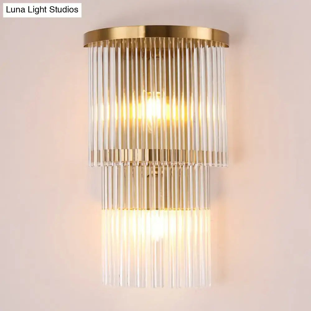 Postmodern gold-toned wall light with cascading clear glass rods for chic living space and bedroom lighting