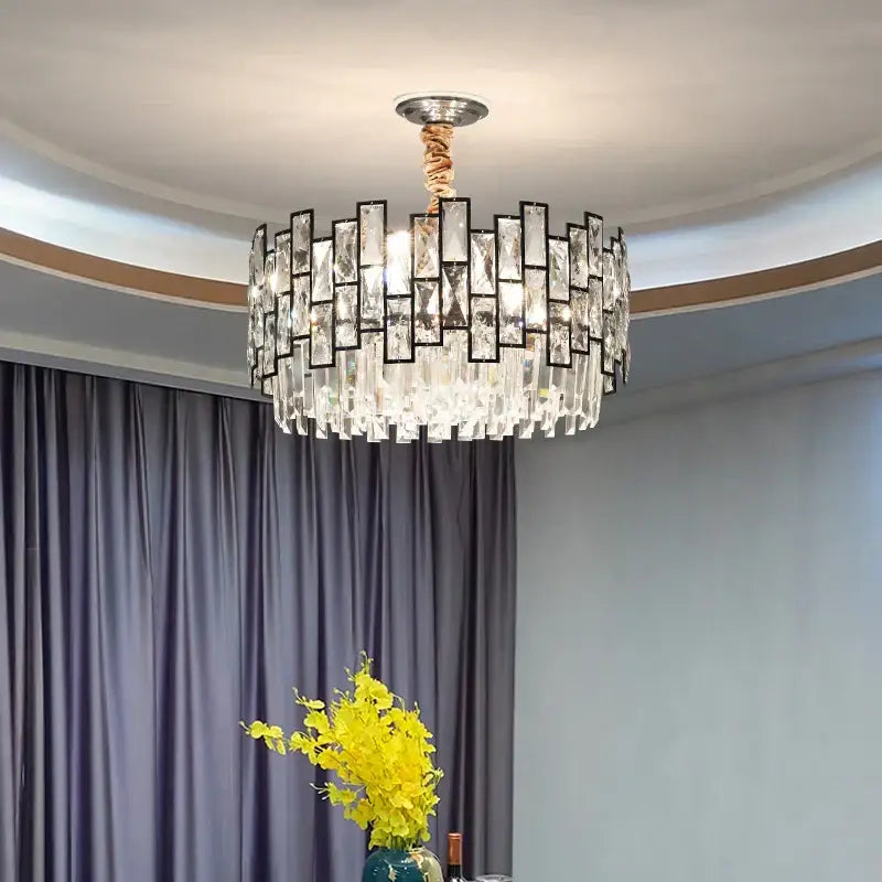 A postmodern decorbites crystal chandelier with clear glass pieces in black frames and twisted copper cord for living room