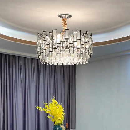 A postmodern decorbites crystal chandelier with clear glass pieces in black frames and twisted copper cord for living room