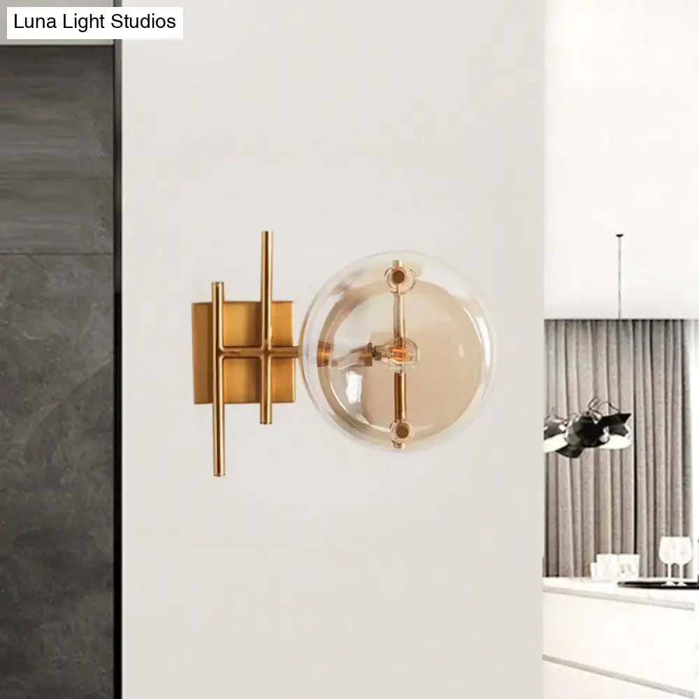 Postmodern gold double ball wall mounted light with spherical glass globe and minimalist metal frame wall lamp