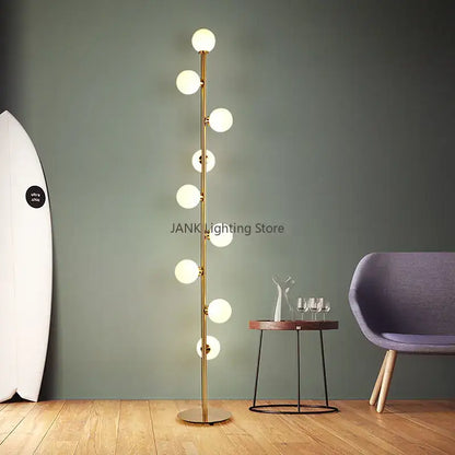 Postmodern gold glass ball standing lamp with multiple spherical bulbs on a slender metallic pole for living room decorbites glass ball