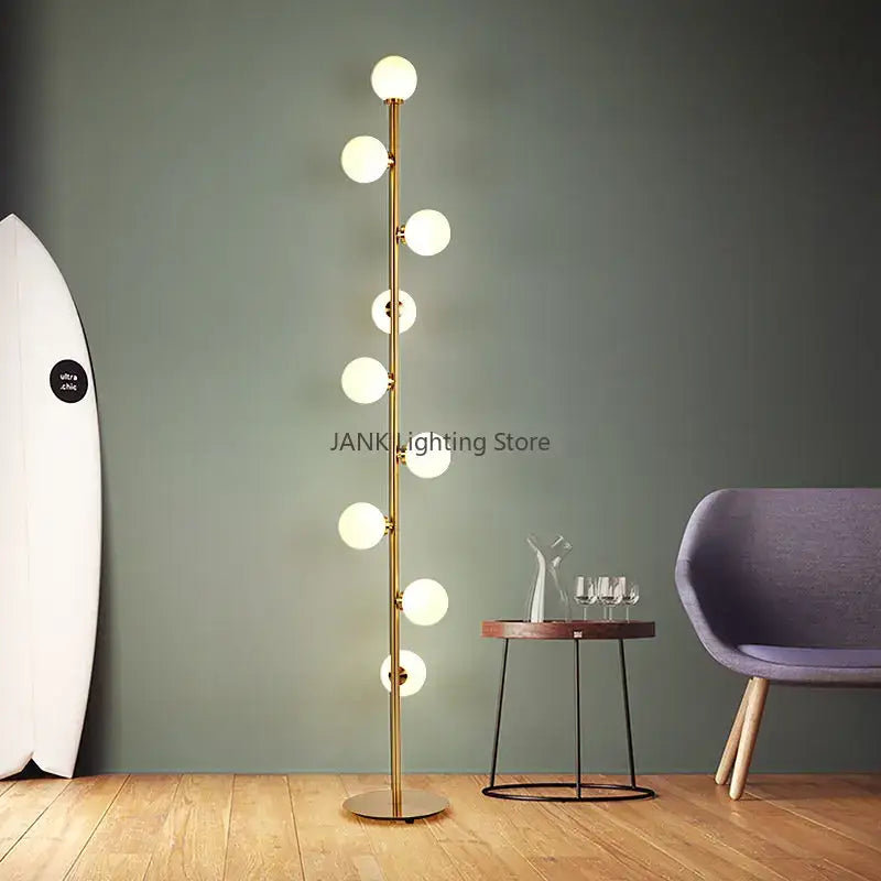 Postmodern gold glass ball standing lamp with multiple spherical bulbs on a slender metallic pole for living room decorbites glass ball