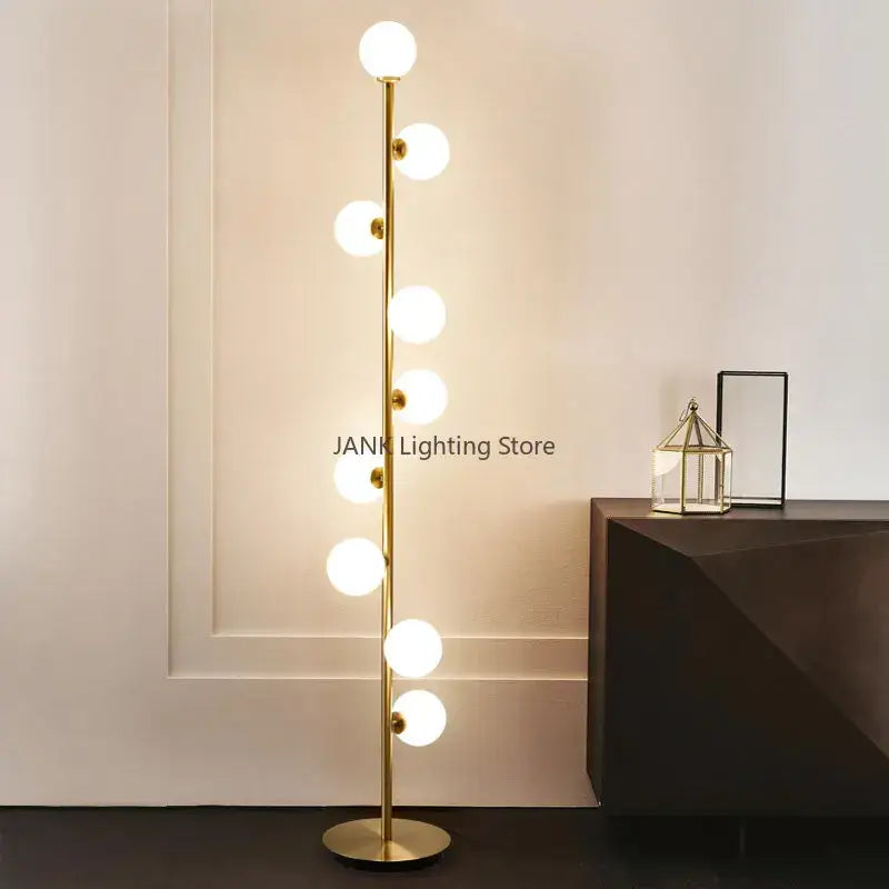 Postmodern gold glass ball standing lamp with slender pole and evenly spaced spherical bulbs for living room decorbites glass ball